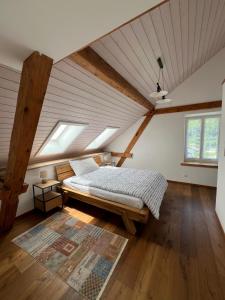 a bedroom with a bed in a attic at Gasthaus zum Freihof in Engi
