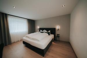 Giường trong phòng chung tại Apart Kraxner