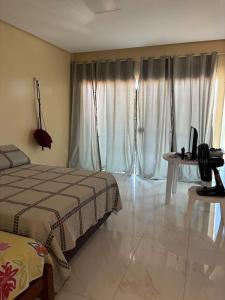 Ένα ή περισσότερα κρεβάτια σε δωμάτιο στο Casa Paracuru