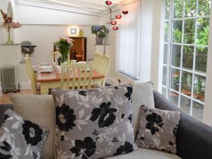 a living room with a couch and a table at The Orangery in Bideford