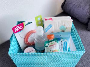 a basket filled with emergency items on a bed at Handwerkswohnung Nova in Oberthulba +34 photos