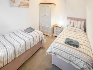 Ένα ή περισσότερα κρεβάτια σε δωμάτιο στο Woodpecker