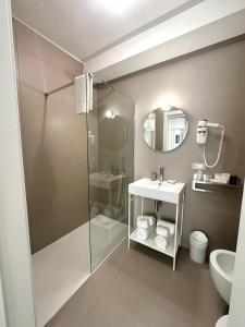 a bathroom with a shower and a sink at B&B Margherita Lido Marini in Lido Marini