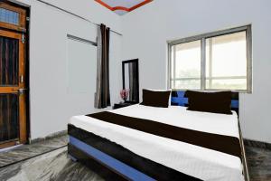 Ένα ή περισσότερα κρεβάτια σε δωμάτιο στο Hotel Moonlight