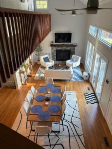 a living room with a table and chairs at Dockside Dream – Your Perfect Waterfront Escape in Lexington