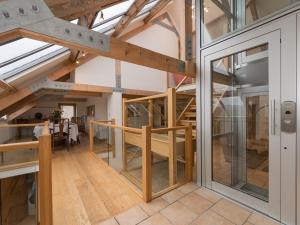 a view of the dining room and kitchen of a loft conversion at Y Beudy in Efenechtyd