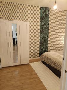 Postel nebo postele na pokoji v ubytování Appartement idéal visite Paris