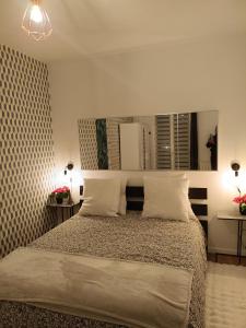 Postel nebo postele na pokoji v ubytování Appartement idéal visite Paris