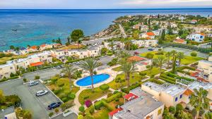 an aerial view of a city and the ocean at Coral Bay Star - Direct sea location in Peyia