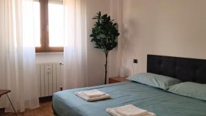 Ένα ή περισσότερα κρεβάτια σε δωμάτιο στο 333apartment near Metro M2 and San Raffaele