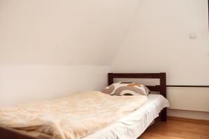 a small bed in a room with white walls at Srce Kozare in Prijedor +57 photos
