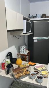 a kitchen with a counter with food on it at Casa da Nise in São Gabriel