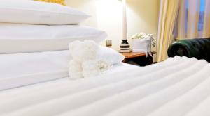 Postel nebo postele na pokoji v ubytování Generali Hotel & Wellness