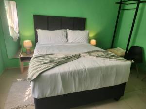 Ένα ή περισσότερα κρεβάτια σε δωμάτιο στο Luxe Residence Guest House