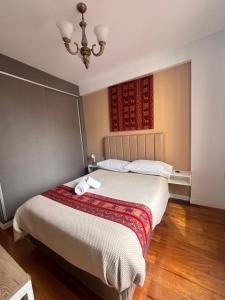 Ένα ή περισσότερα κρεβάτια σε δωμάτιο στο Confortable y lindo Departamento en la mejor Zona