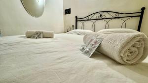 Postel nebo postele na pokoji v ubytování [2 passi dal mare di Alassio] Ampio trilocale