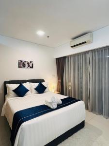Voodi või voodid majutusasutuse Cozy mercu summer suite 5mint WD KLCC luxury apartment free wifi, netfliix toas +16 fotot