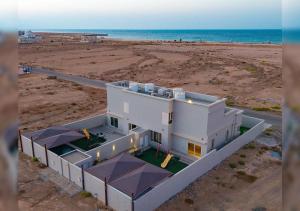 an aerial view of a house on the beach at Naseem Sur 