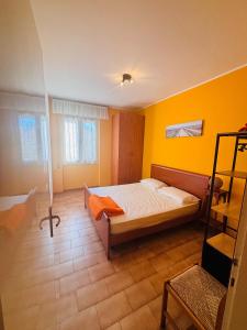 Postel nebo postele na pokoji v ubytování Appartamento Girasole