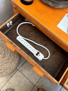 a nintendo wii controller sitting on top of a table at The Cottage in Panguitch