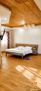 Ένα ή περισσότερα κρεβάτια σε δωμάτιο στο Pazuri Villas