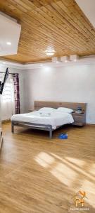 Ένα ή περισσότερα κρεβάτια σε δωμάτιο στο Pazuri Villas