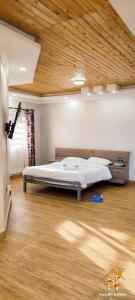 Ένα ή περισσότερα κρεβάτια σε δωμάτιο στο Pazuri Villas +13 φωτογραφίες