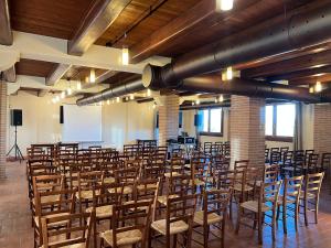 a room with a bunch of chairs in it at Collina dei Poeti in Santarcangelo di Romagna