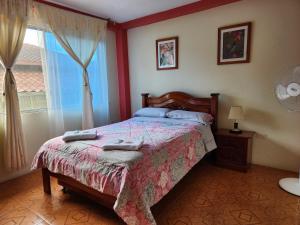 Postel nebo postele na pokoji v ubytování Departamento Puyo Fantastic. + 7 fotografií