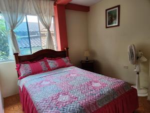 Postel nebo postele na pokoji v ubytování Departamento Puyo Fantastic.