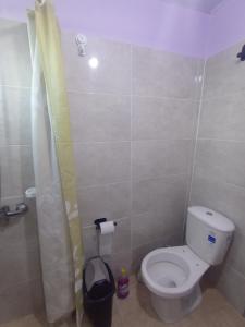 a small bathroom with a toilet and a shower at Pe-Pé Pe-Pé in Estación Costa Azul +14 photos
