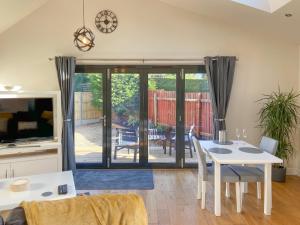 a living room with a white table and chairs at Woodside Retreat, Number 37 in Worthington