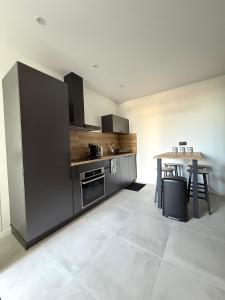 Kuchyň nebo kuchyňský kout v ubytování Appartement 2 pièces neuf Toul proche gare