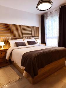 a bedroom with a large bed and a window at Paraíso del mar- Villa privada con piscina propia y vista al mar cerca de la playa in Fuengirola +54 photos