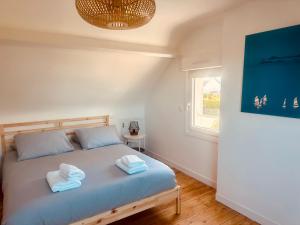 En eller flere senge i et værelse på Maison avec piscine chauffée toute l'année