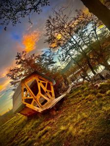 a run down house on the side of a hill at Surí refugios Aquasol, Carretera Austral, Cochrane in Cochrane