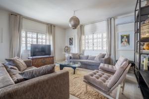 Un televizor și/sau centru de divertisment la Le 5 ter