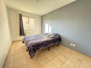 Ένα ή περισσότερα κρεβάτια σε δωμάτιο στο Maison plain-pied