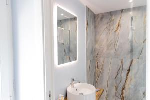 a bathroom with a sink and a mirror at Casa twins in Fiumicino +61 photos