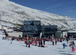 a group of people standing in the snow in front of a building at Bibelot in Reinosa
