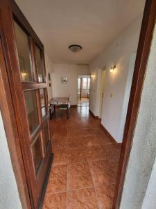 an empty hallway with a door and a pool table at Seaside Apartment Bubi in Crikvenica +33 photos