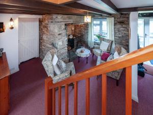 an overhead view of a living room with a stone wall at The Bickney in Llanrian