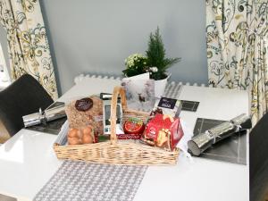 a basket of food sitting on a table at Bookkeepers Place in Bakewell