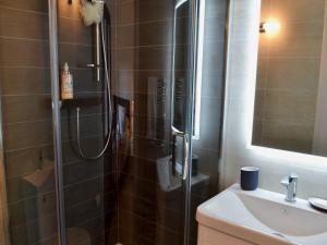 a bathroom with a shower and a sink at Bookkeepers Place in Bakewell +5 photos