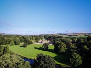 an aerial view of a mansion with trees and a lake at Bell Flat - Uk42250 in Broughton