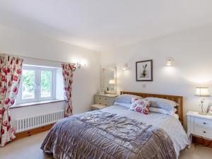 Ένα ή περισσότερα κρεβάτια σε δωμάτιο στο New Park Farm - Church Cottage +14 φωτογραφίες