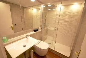 a bathroom with a shower and a toilet and a sink at Fraternitat SDB in Barcelona
