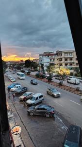 a group of cars parked in a parking lot at Hostel le Coin d'Or in Fort de lʼEau