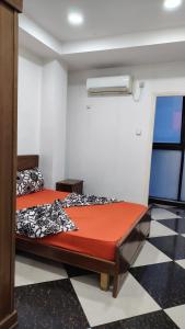 a bedroom with two beds and a window at Hostel le Coin d'Or in Fort de lʼEau +12 photos