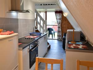 a kitchen with a stove and a counter top at Bay View in Kingsdown